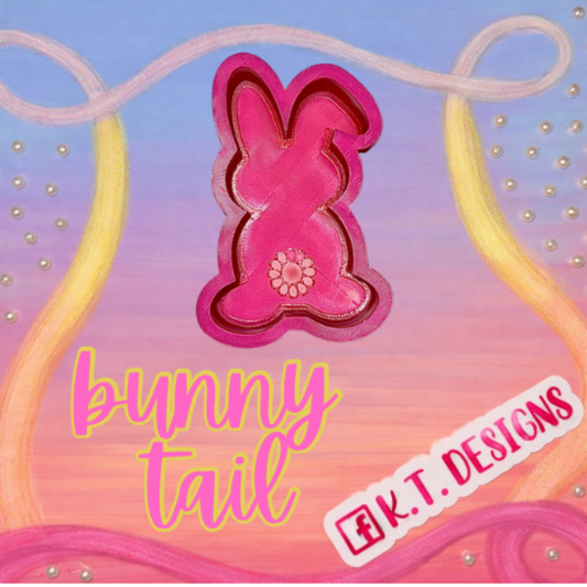 Pink bunny with  tail silicone freshie mould with  K.T. Designs logo on a colorful background.