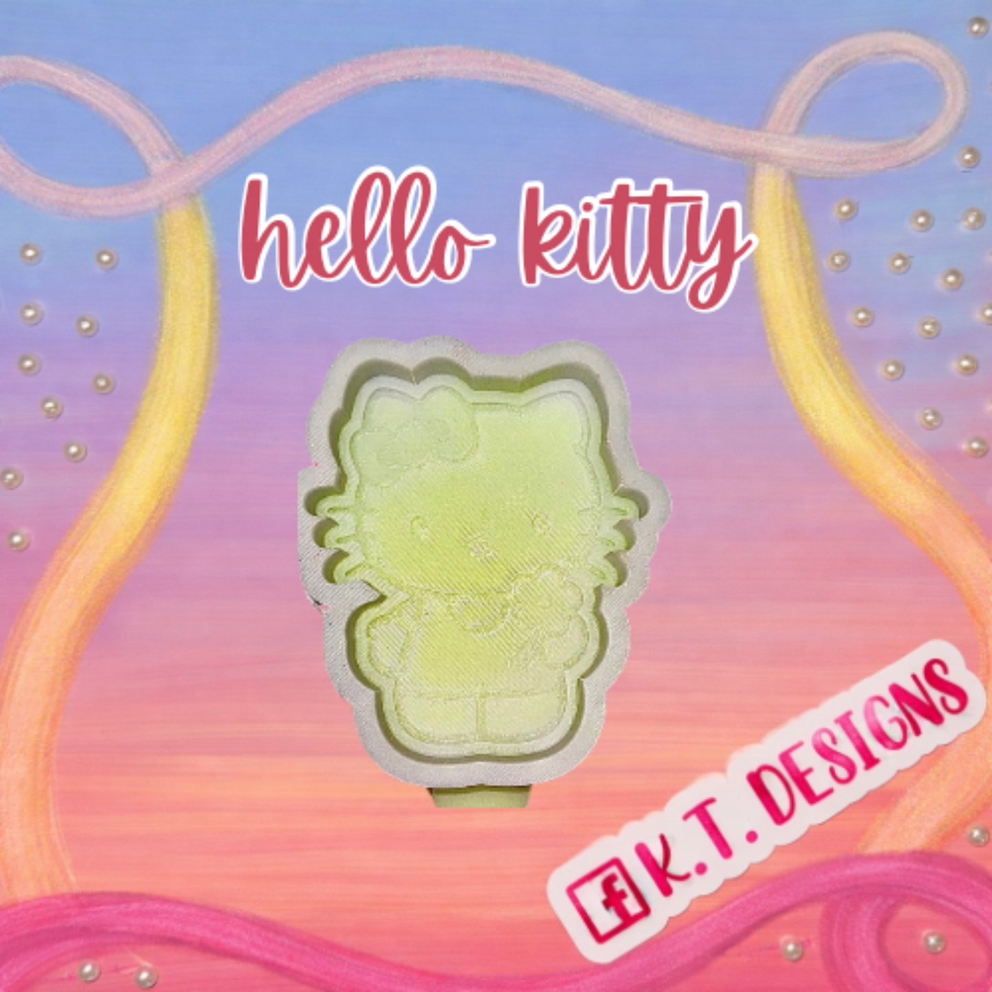 Decorative item with 'hello kitty' text and K.T. Designs logo on a colorful background