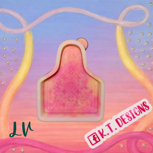 Pink and orange freshie with the LV logo on a colorful background, featuring 'K.T. DESIGNS'.